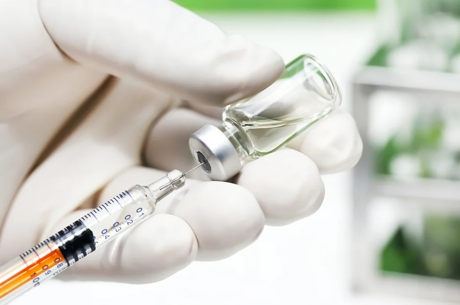 vial of radiesse lip fillers and syringe