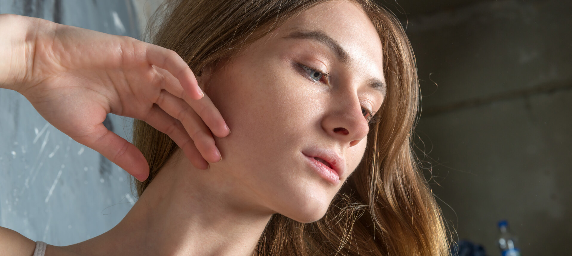 A specialist providing non-surgical TMJ treatment to a patient to relieve jaw pain and muscle tension at Montville Medspa.