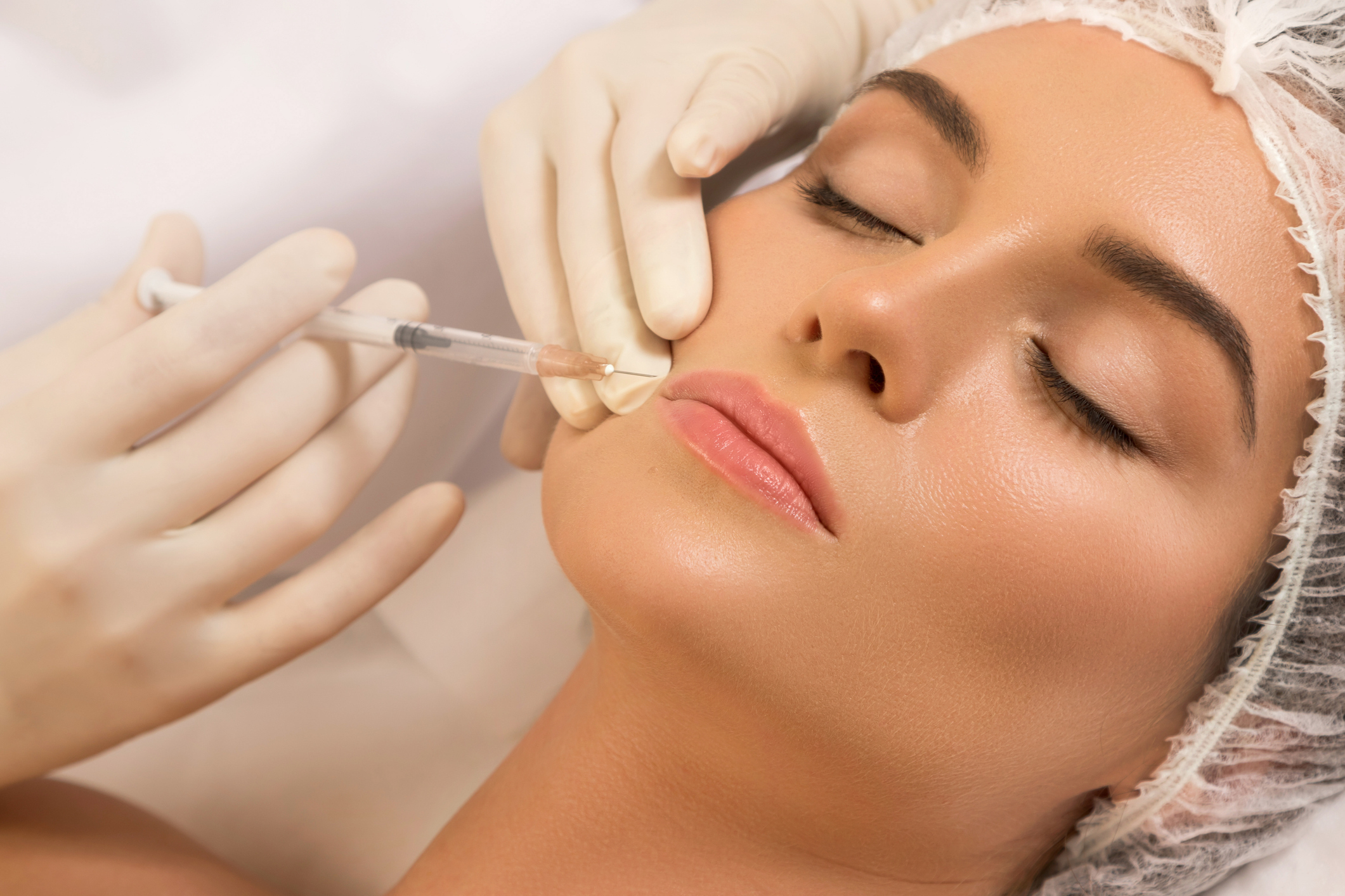 Woman during lips augmentation procedure.